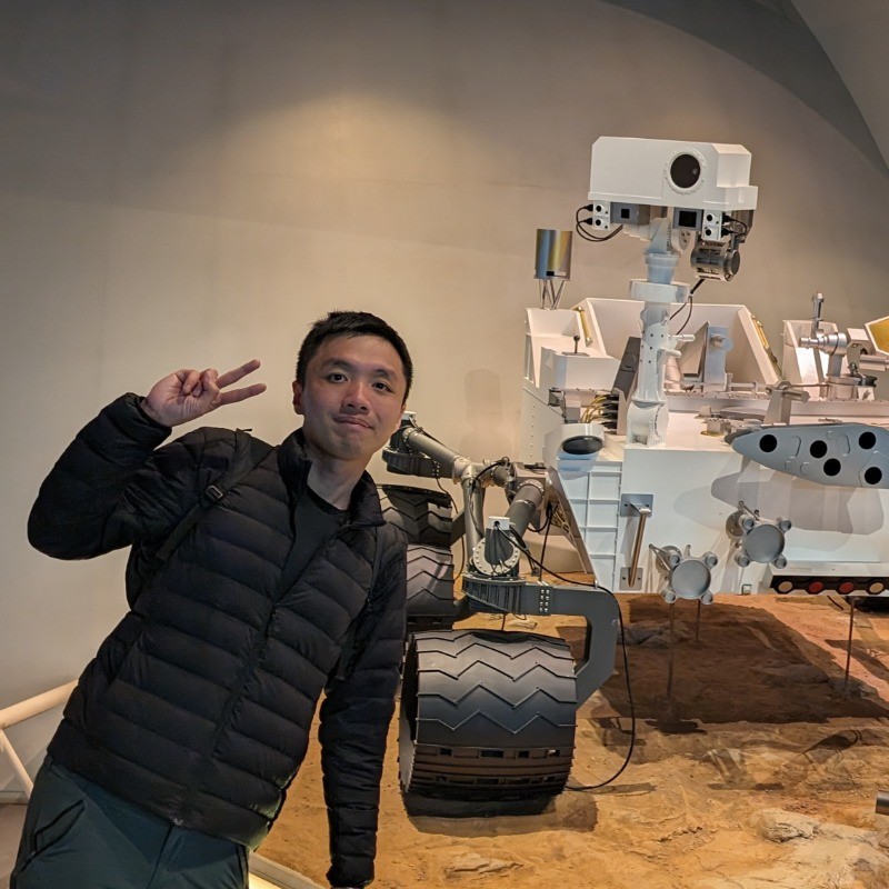 Gary Phua beside a rover exhibit